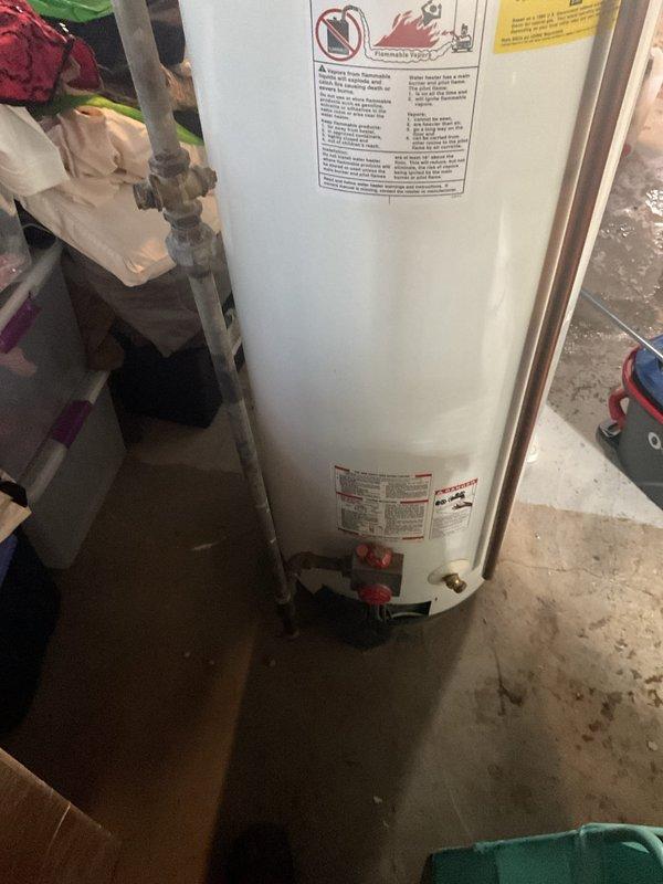Completed installation of new tanked water heater in basement utility area. Installed unit includes proper water supply connections with copper piping, pressure relief valve configuration, and shut-off valves at base of tank for maintenance access. All plumbing connections were secured and tested for proper operation.