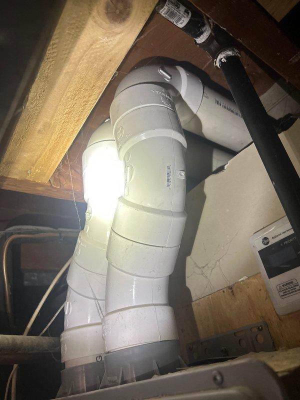 Responded to service call for non-operational tankless water heater displaying error code 1E. Unit was originally installed in 2012 and had reached end of service life. Accessed equipment in crawl space beneath structure, documented existing installation including PVC venting configuration and utility connections. Assessed condition of unit and confirmed system failure, recommending complete replacement due to age and diagnostic error code indicating internal component malfunction that is not economically repairable on units of this vintage.