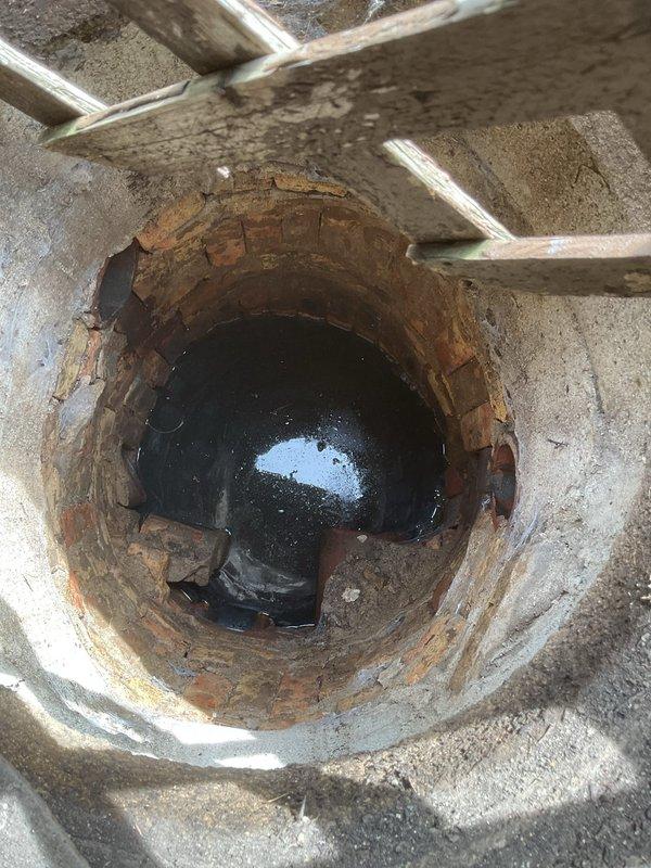 Performed routine preventative maintenance on residential sewer line via basement access point. Conducted thorough rodding of main drain line to clear any potential buildup and ensure proper flow. Upon inspection, found existing plumbing infrastructure showing signs of age with visible corrosion on cast iron pipe fittings and connections, though all components remained functional. Accessed cleanout located in concrete floor of basement utility area. Line cleared successfully with no obstructions encountered. System tested and confirmed flowing properly with no current drainage issues identified. Documented existing condition of aging plumbing components including heavily corroded pipe joints at base of main stack. All work completed as scheduled with tenant providing site access.