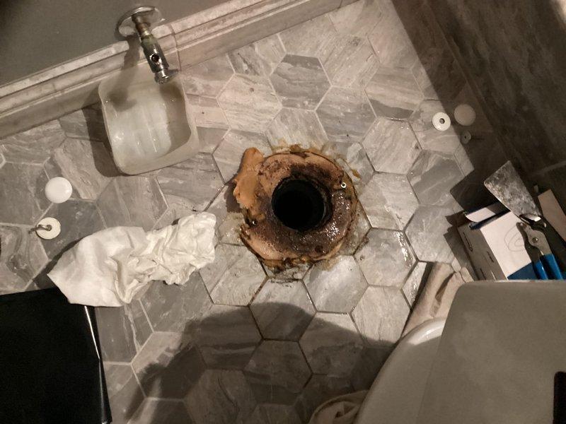 Responded to priority service call for toilet leak issue. Upon inspection, found severely corroded and rusted toilet flange with compromised wax ring seal. Removed toilet from flange, confirmed wax ring failure as source of leak. Replaced deteriorated wax ring with new seal and reinstalled toilet to proper specifications. Verified secure mounting and tested for leaks to ensure proper operation.
