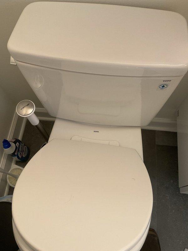Responded to service call for TOTO toilet experiencing progressively worsening low flow condition over the past month. Upon arrival, performed visual inspection of toilet assembly and surrounding plumbing fixtures. Diagnosed restricted water flow issue affecting flush performance. Inspected tank components, fill valve, flush valve assembly, and rim jets for mineral buildup or obstructions. Cleared blocked rim jets and siphon jet to restore proper water distribution during flush cycle. Verified adequate water level in tank and proper float adjustment. Tested flush performance multiple times to confirm full restoration of flow and bowl evacuation. Toilet now operating at manufacturer specifications with complete flush cycle and proper bowl refill.