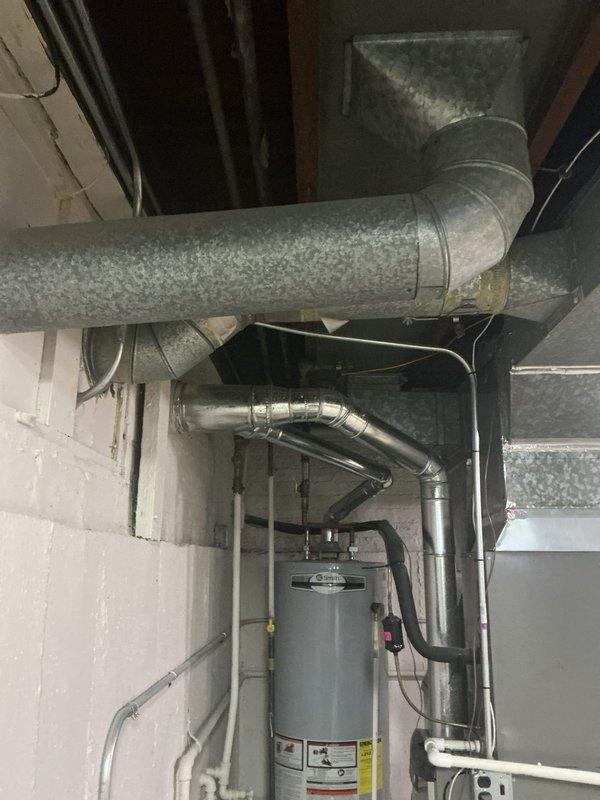 Conducted plumbing estimate for replacement of existing galvanized water supply piping system in basement utility area. Inspected and documented current galvanized pipe configuration, connections, and condition throughout the space. Assessed scope of work required to replace outdated galvanized piping with modern copper or PEX piping to eliminate corrosion issues and improve water quality and flow. Evaluated access points, pipe routing, and integration with existing water heater and HVAC systems in unfinished basement environment.