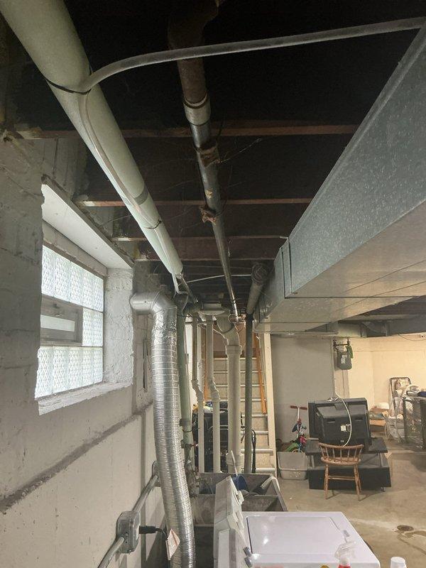 Conducted plumbing estimate for replacement of existing galvanized water supply piping system in basement utility area. Inspected and documented current galvanized pipe configuration, connections, and condition throughout the space. Assessed scope of work required to replace outdated galvanized piping with modern copper or PEX piping to eliminate corrosion issues and improve water quality and flow. Evaluated access points, pipe routing, and integration with existing water heater and HVAC systems in unfinished basement environment.
