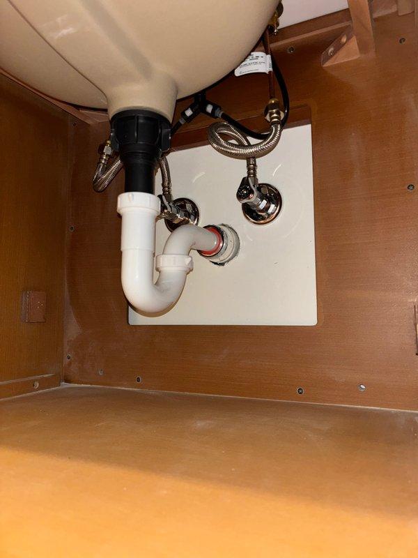 Completed follow-up installation of toilet and sink fixtures after customer finished tile work as previously requested. Successfully installed sink with new P-trap assembly, garbage disposal unit, chrome shut-off valves, and braided stainless steel supply lines. Installed toilet with proper flange mounting and wax seal on newly tiled floor surface. All plumbing connections tested and verified leak-free with proper drainage functionality.