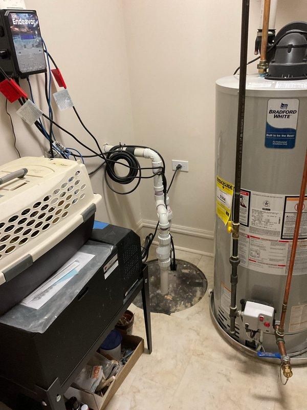 Responded to service call for leaking outdoor spigot and clogged bathroom sink. Inspected exterior hose bib mounted on brick wall and identified leak at valve connection point. Assessed plumbing configuration in utility room including water heater connections and main shut-off locations. Repaired outdoor spigot by replacing faulty valve assembly and securing mounting hardware to exterior wall. Tested water flow and verified leak was eliminated with no dripping or seepage at connection points. Cleared bathroom sink drain obstruction to restore proper drainage.