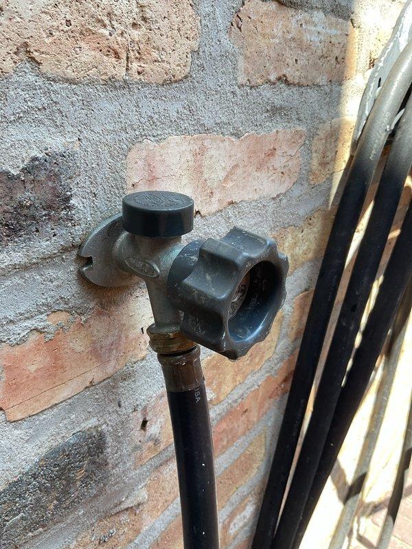 Responded to service call for leaking outdoor spigot and clogged bathroom sink. Inspected exterior hose bib mounted on brick wall and identified leak at valve connection point. Assessed plumbing configuration in utility room including water heater connections and main shut-off locations. Repaired outdoor spigot by replacing faulty valve assembly and securing mounting hardware to exterior wall. Tested water flow and verified leak was eliminated with no dripping or seepage at connection points. Cleared bathroom sink drain obstruction to restore proper drainage.