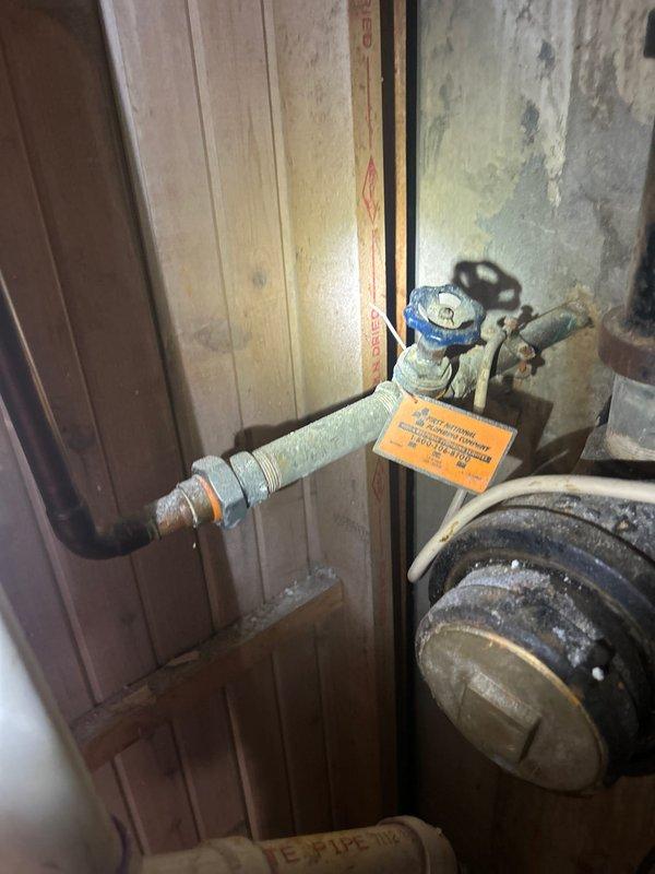 Responded to service call for dripping shower head in residential bathroom. Upon inspection, identified leak originating from the shower control valve assembly. Examined the dual-control chrome fixture mounted in tiled shower enclosure, noting water seepage from the upper lever handle mechanism. Assessed main water supply lines and shutoff valves in basement utility area to ensure proper system pressure and isolation capability. Repaired the faulty shower valve cartridge, replacing worn internal seals causing the persistent drip. Tested the fixture operation post-repair to verify proper flow control and complete shutoff without leakage. System restored to full functionality with no further dripping observed.