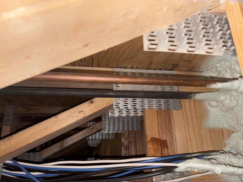 Performed diagnostic assessment and repair of HVAC system components located in attic space. Utilized professional-grade testing equipment including digital multimeters, thermal imaging camera, and infrared temperature measurement devices to evaluate system performance and identify issues. Inspected ductwork installation, including metal supply ducts with perforated grilles, verified proper airflow through ventilation openings, and examined electrical wiring connections serving the HVAC equipment. Completed necessary repairs to restore system to proper working condition, ensuring all components met manufacturer specifications and building code requirements.
