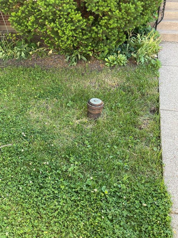 Responded to clogged kitchen sink backup issue. Upon arrival, investigated potential weather-related drainage problems due to recent heavy rainfall in the area. Inspected exterior cleanout access point in lawn area to assess main sewer line condition and determine if backup was caused by external drainage issues or internal plumbing obstruction. Documented cleanout location and condition for service records.