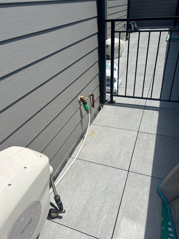 Performed site evaluation on rooftop terrace for natural gas line extension to accommodate outdoor grill installation. Assessed existing gas infrastructure, documented current utility configurations including wall-mounted fixtures and equipment locations, and determined optimal routing path for new gas line across tiled deck surface. Provided comprehensive quote for gas line extension work including materials, labor, and pressure testing requirements upon completion.