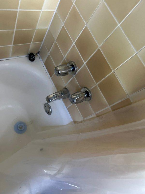 Rebuilt double-handle tub/shower faucet system requiring specialized cartridge not available on service vehicle. Made supply house trip to obtain correct replacement cartridge, completed installation, and verified proper hot and cold water control operation with no leaks.