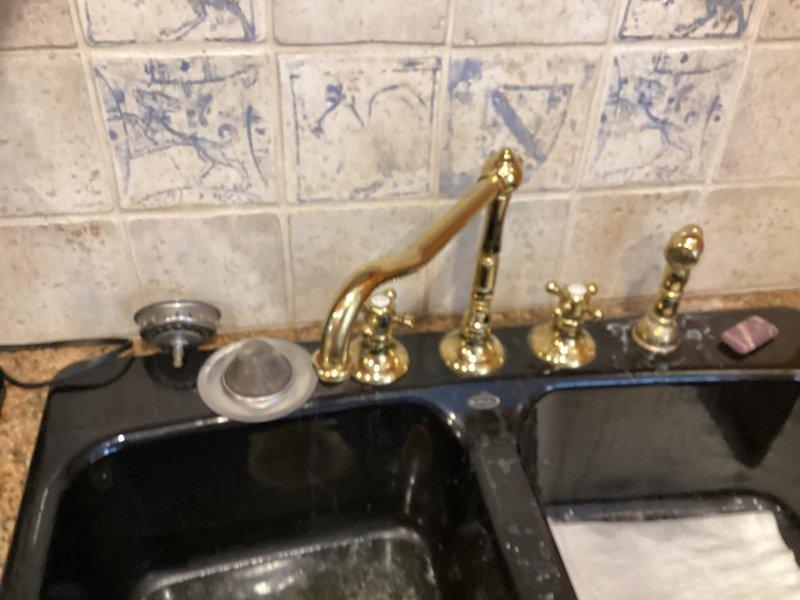 Conducted comprehensive drain and sewer assessment for commercial building requiring facility shutdown at 9AM. Inspection included evaluation of plumbing fixtures in bathroom facilities featuring traditional brass fixtures and kitchen area with double-basin sink installation and ornate brass faucet assembly. Documented existing conditions through photographic documentation to support estimate preparation for drain and sewer system services.