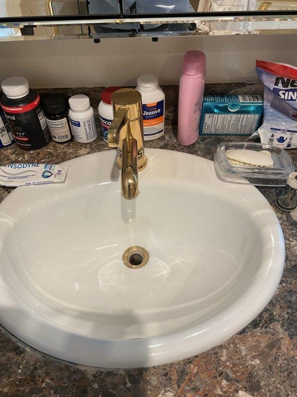Replaced defective anti-siphon valve cap on outdoor spigot that was causing water to spray during hose operation. Removed failed components and installed new cap assembly to restore proper function and eliminate leakage at the valve body.