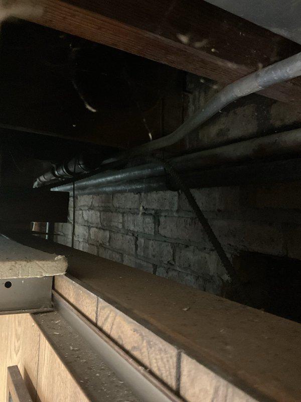 Responded to a gas leak emergency at residential property where the gas supply had been shut off as a safety precaution. Conducted comprehensive pressure testing and leak detection throughout the gas distribution system, identifying approximately 5-6 active leak points in the aging plumbing infrastructure. Inspected older gas piping system in basement and crawl space areas, documenting corroded fittings, deteriorated valve housings, and compromised pipe connections showing significant weathering and age-related degradation. Photographed all identified leak locations and affected components for documentation and estimate preparation purposes. Gas supply remains shut off pending necessary repairs to restore system integrity and safe operation.