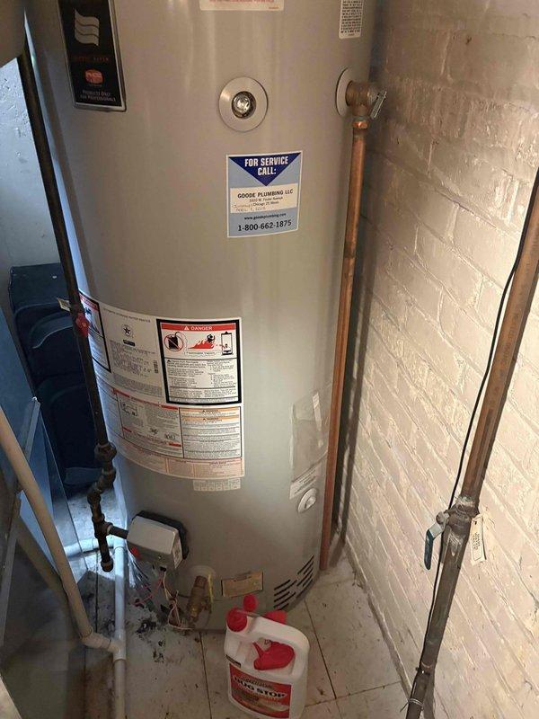 Responded to no hot water complaint at residential property with 70-year-old infrastructure and tank-style water heater. Upon arrival, conducted comprehensive diagnostic assessment of the water heating system. Inspected the white cylindrical tank water heater located in basement utility area, examining all visible components including copper supply lines, pressure relief valve, temperature controls, and venting system.

Evaluated the metallic exhaust vent connector at top of unit for proper draft and combustion air flow. Tested electrical connections and thermostat functionality to determine root cause of complete hot water loss throughout home. Examined the condition of copper piping infrastructure, brass fittings, and shut-off valves for any signs of leaks, corrosion, or mechanical failure.

Checked pilot light assembly and burner operation on gas-fired unit. Verified proper gas supply and pressure to appliance. Inspected flue pipe connections and draft diverter for blockages or impr