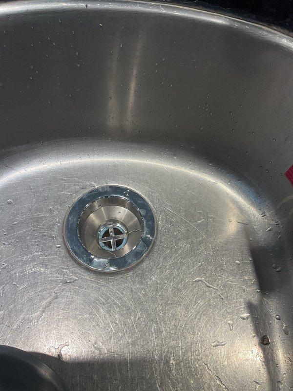 Responded to a leak underneath the kitchen sink equipped with a reverse osmosis system. Upon inspection, identified severely corroded and deteriorated metal gaskets and seals at the drain assembly connection points. Disassembled the affected plumbing components, removed the failed corroded gaskets, and replaced them with new seals to restore proper watertight connections and eliminate the leak.