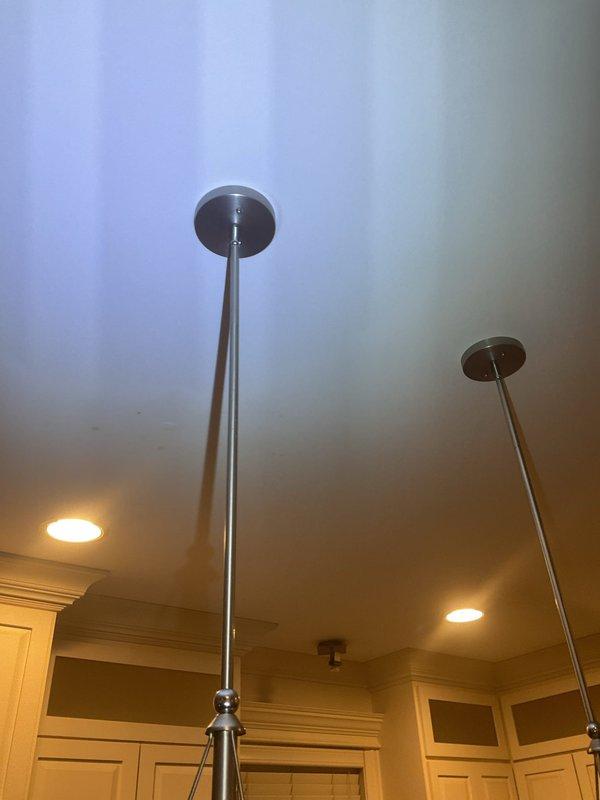 Responded to water leak complaint originating from kitchen ceiling light fixture. Upon arrival, conducted visual inspection of pendant light fixtures and surrounding ceiling area to identify source of moisture intrusion. Investigated above-ceiling conditions and plumbing lines in proximity to affected lighting fixtures to determine leak origin and assess extent of water damage requiring remediation.
