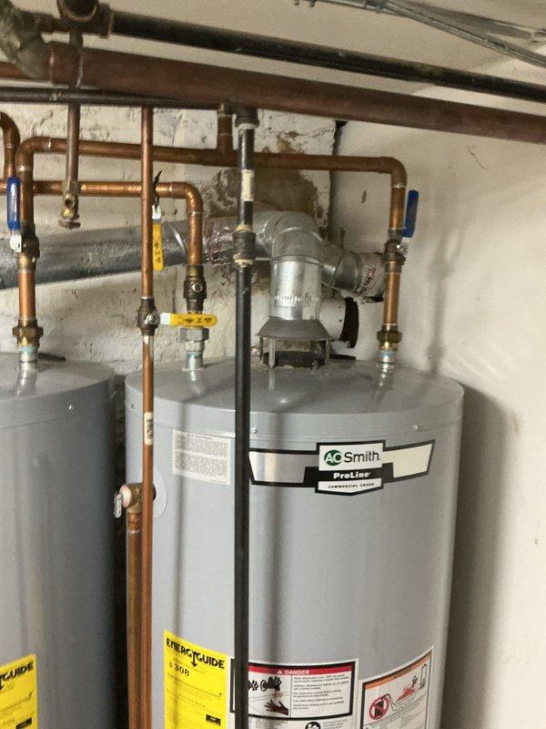 Completed annual plumbing maintenance inspection on residential water heating system. Performed comprehensive evaluation of A.O. Smith ProLine water heater, including inspection of copper supply lines, shut-off valves, pressure relief valve, and venting components. Verified proper operation of circulation pump and assessed condition of all pipe connections and fittings. Inspected sump pit and confirmed adequate drainage function with normal water level present. All system components found to be operating within normal parameters with no immediate service needs identified.