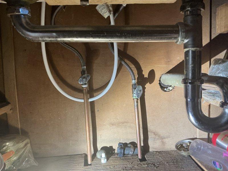 Responded to service call for slow-draining kitchen sink and bathtub. Inspected under-sink plumbing configuration including P-trap, supply lines, and drain connections, which customer had previously checked. Assessed basement plumbing infrastructure including drain lines, copper piping, and associated connections to diagnose drainage issues affecting multiple fixtures. Documented existing plumbing conditions and provided estimate recommendations for necessary repairs to resolve the slow drainage problems throughout the system.