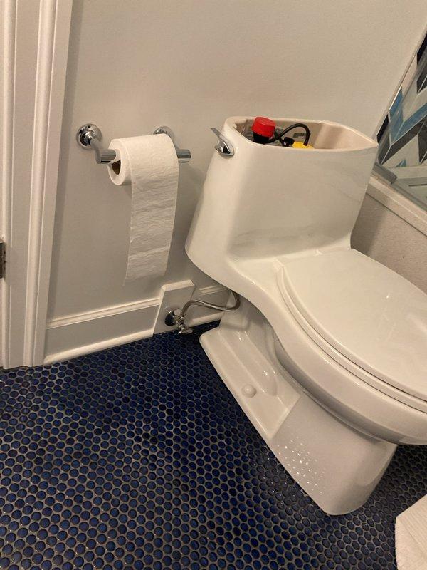 Responded to service call for non-functioning toilet. Upon inspection, removed tank lid and assessed internal flushing mechanism components including fill valve and flush valve assembly. Identified issue with flush system operation, performed necessary repairs to restore proper flushing function. Verified toilet operation and confirmed system working correctly before completing service.