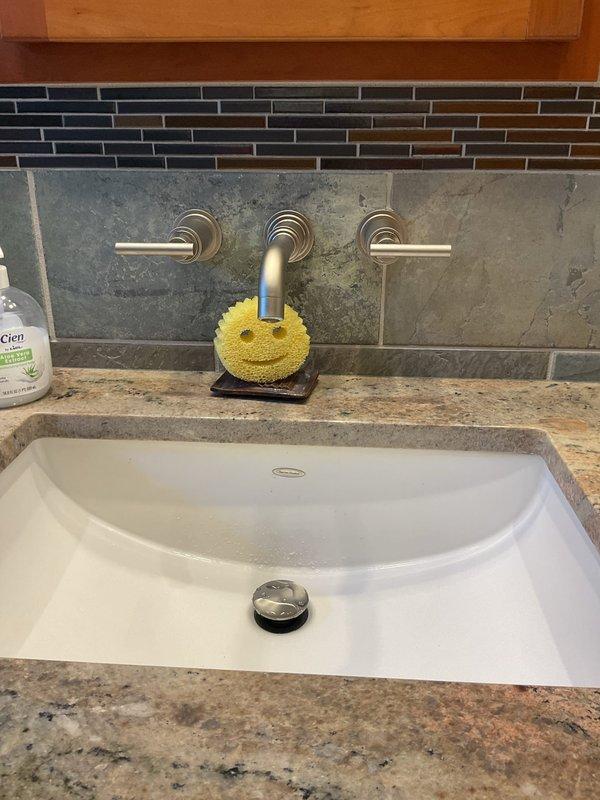 Responded to service call at century-old residential property for multiple drain issues affecting two bathrooms. Addressed clogged bathtub drain in primary bathroom and recently developed sink stoppage in secondary bathroom. Cleared both drain obstructions using mechanical augering methods appropriate for older cast iron and galvanized piping systems. Restored proper drainage flow to both fixtures and verified water evacuation rates met acceptable standards. Additionally inspected and repaired minor faucet drip that had been present for approximately one month, replacing worn internal components to eliminate water waste. Tested all affected fixtures post-repair to confirm full functionality. All drains flowing freely with no backup or slow drainage observed at completion.