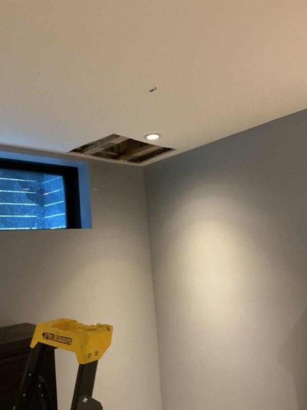 Responded to emergency call for outdoor spigot leaking into interior living space. Upon inspection, identified failed outdoor hose bib allowing water intrusion through foundation wall into unit. Accessed leak source through ceiling cavity to assess extent of water damage and confirm leak origin point. Replaced defective outdoor spigot with new frost-free sillcock, ensuring proper seal at foundation penetration to prevent future water intrusion. Tested installation under full water pressure to verify complete leak elimination and proper operation.