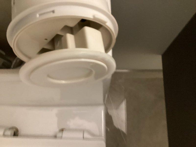 Responded to a Duravit toilet experiencing continuous hissing, phantom flushing, and internal dripping sounds that persisted after previous repair attempts. Inspected the dual-flush tank mechanism and identified issues with the fill valve assembly and flush valve components. Documented the existing condition of the internal flushing mechanism, including the float mechanism, flapper assembly, and connecting hardware for necessary repairs.