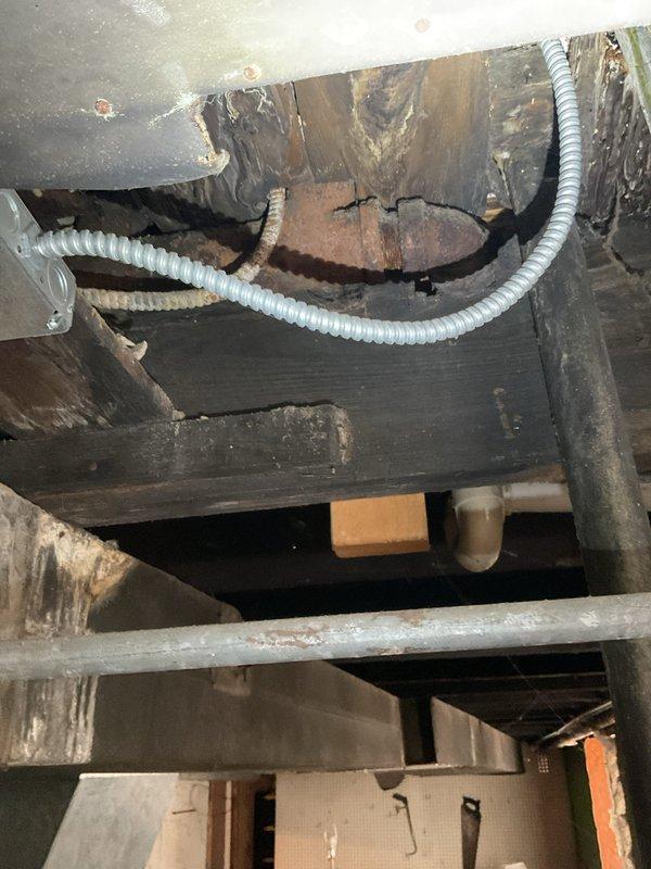 Responded to service call for clogged bathtub drain line and successfully cleared the obstruction using professional rodding equipment. Accessed drain line from crawlspace area beneath fixture, working around existing plumbing infrastructure, HVAC ductwork, and copper supply lines to restore proper drainage function.