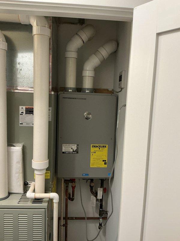 Completed follow-up consultation to assess hot water system improvement options at residential property. Evaluated existing HVAC and water heating equipment configuration in utility closet, including wall-mounted Performance Platinum unit with integrated ductwork, storage tank, and associated PVC and copper piping with shutoff valves. Provided recommendations and estimates for upgrading hot water delivery system to address inadequate hot water supply issues previously discussed during initial service visit.
