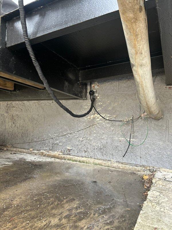 Responded to service call for leak originating from outdoor spigot entering storage unit area. Upon inspection, accessed crawl space and utility chase to locate source of water intrusion. Identified compromised piping connection at outdoor spigot supply line where it penetrated foundation wall into storage area. Traced supply plumbing through vertical chase containing existing drainage and water supply infrastructure. Assessed condition of copper supply lines, fittings, and connection points in confined utility space. Addressed leak at spigot penetration point and verified proper function of outdoor fixture. Restored water-tight integrity to prevent further moisture infiltration into storage unit.