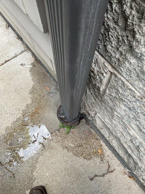 Responded to exterior sewer line stoppage that developed the same morning at an 18-year-old residential property. Upon arrival, located the affected area outside the home near the building's drainage system and downspout connection point. Performed diagnostic assessment of the sewer line to identify the blockage location and severity. Successfully cleared the obstruction using professional drain cleaning equipment, restoring proper flow and drainage function to the main sewer line. Verified complete clearance through water flow testing to ensure system was operating normally with no remaining restrictions.