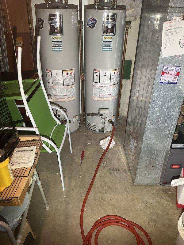 Completed enrollment and payment collection for Silver VIP annual membership covering all water heater and pump system maintenance and service for single-family residence. Membership includes priority dispatching, waived dispatch and emergency fees, discounted VIP pricing on all services, comprehensive annual plumbing system evaluation, water heater flush and maintenance for gas/electric tank or tankless units, and pump and pit inspection with check valve service. Documentation and photos taken of dual water heater installation in basement utility area showing both units with proper labeling, copper supply piping, brass fittings, gas controls, and drain valves in operational condition. Membership renewal processed with continuous coverage transition.