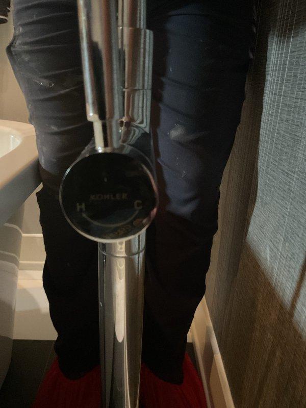Completed diagnostic evaluation of two faucet issues in residential property. Inspected bridge-style Kohler kitchen faucet with dual cross-handle controls experiencing intermittent annual leaking. Assessed bathroom tub/shower diverter system where handheld spray function was inoperative, preventing proper tub filling. Documented existing fixtures and plumbing configuration with photographic evidence for repair recommendations.