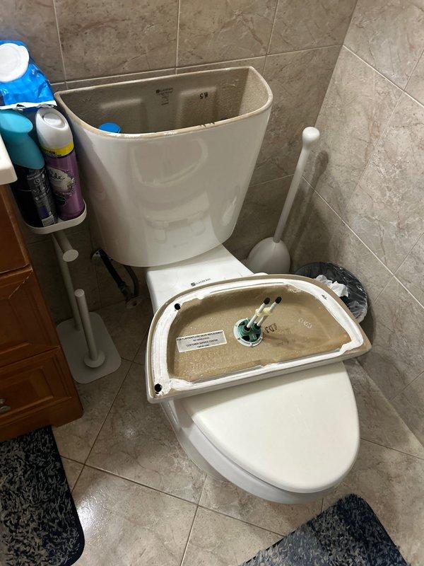 Responded to multiple plumbing issues throughout the property. Inspected first-floor toilet with slow tank fill issue and found sediment buildup and discolored water in tank, indicating potential fill valve malfunction or supply line restriction. Removed tank lid to assess internal flush mechanisms including float valve assembly and flush valve components. Evaluated basement toilet leaking at base, which typically requires wax ring replacement and closet flange inspection. Assessed basement bathroom sink with low water pressure issue. Inspected refrigerator cold water supply line as requested.