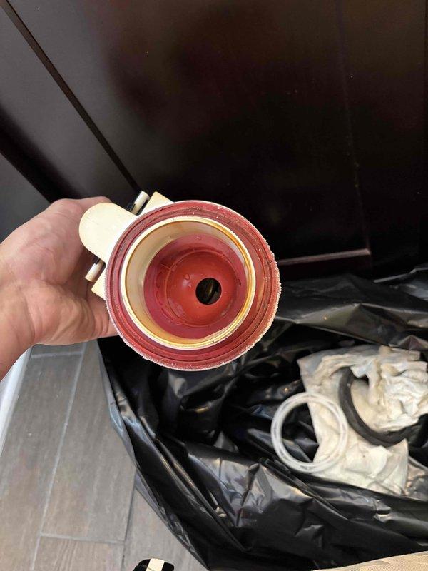 Responded to a toilet tank that was periodically refilling every 10-15 minutes following recent installation of aftermarket Korky flapper and fill valve components. Upon inspection, diagnosed a faulty flush valve seal causing a slow leak from the tank into the bowl, triggering the fill valve to activate repeatedly. Removed and replaced the compromised flush valve assembly, which showed significant mineral buildup and deterioration of the sealing surfaces. Tested the system to confirm proper operation with no phantom flushing or continuous running.