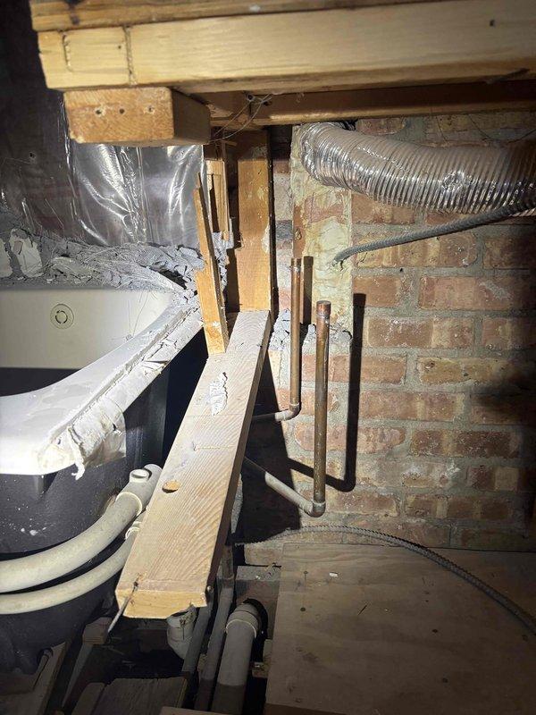 Completed comprehensive plumbing estimate for exposed wall piping replacement and updates in basement/crawl space area. Assessed existing white PVC drainage and waste lines, evaluated structural access points through exposed wooden framing, and documented current infrastructure conditions including proximity to HVAC ductwork, insulation barriers, and mechanical systems for coordinated installation planning.