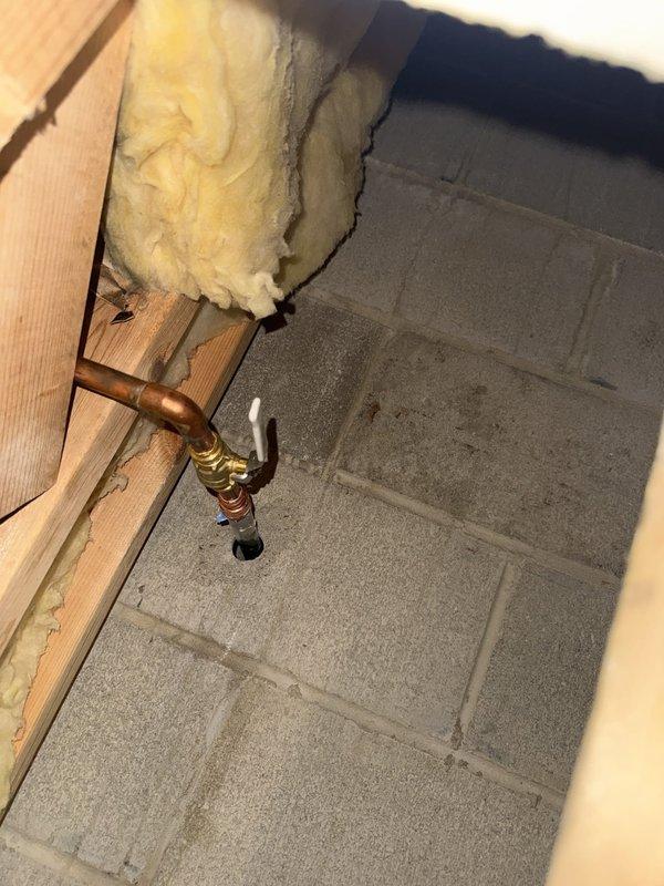 Responded to service call for outdoor faucet installation requiring soldering work to existing copper piping. Accessed exposed copper plumbing lines in utility area where drywall had been previously removed. Successfully soldered outdoor faucet cassette to indoor copper piping, ensuring proper connection and seal at brass valve fitting. Verified system integrity and tested for leaks upon completion.