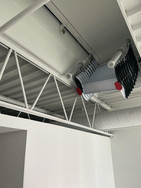 Responded to service call for evaluation of potentially broken sewer line at commercial facility. Upon arrival, conducted thorough inspection of the premises to assess the reported drainage issue. Documented existing conditions through comprehensive photographic survey of the mechanical systems and infrastructure present in the space. The inspection revealed a commercial HVAC installation with exposed ceiling-mounted equipment including finned heat exchanger units, ductwork, and associated mounting hardware in what appears to be a mechanical room or service area. Evaluated the structural framework, support systems, and routing of utilities to determine scope of work required for sewer line repair or replacement. Gathered necessary information and visual documentation to prepare detailed estimate for recommended corrective action on the sewer system.