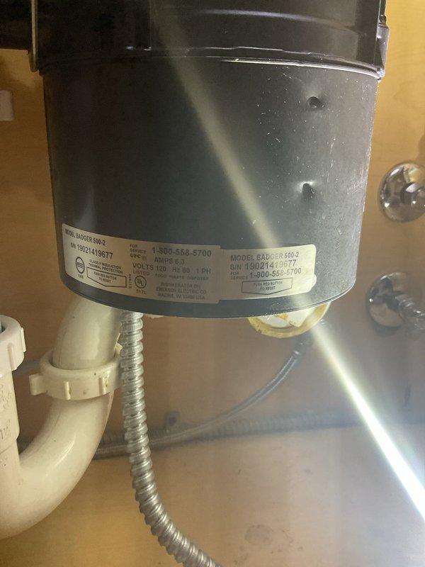 Responded to service call for inoperative garbage disposal unit. Upon inspection, found InSinkErator Badger 500-2 model disposal jammed due to foreign object obstruction. Removed obstruction from grinding chamber, tested motor function and reset mechanisms, and verified proper operation of disposal unit. Confirmed drainage system and P-trap connections secure with no leaks. Unit restored to full working condition.