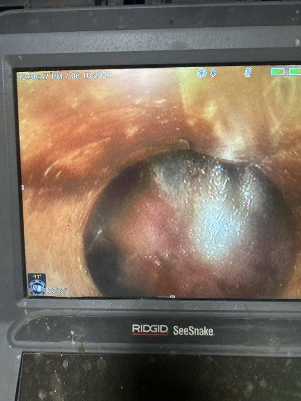 Responded to service call for backing up toilets where previous contractor had diagnosed a cracked sewer line via camera inspection. Performed independent video camera inspection of the main sewer line to provide second opinion on reported damage. Used RIDGID SeeSnake camera system to thoroughly examine pipe interior conditions and verify presence and extent of any structural defects. Documented findings with video footage and photographic evidence for customer review and informed decision-making regarding necessary repairs.