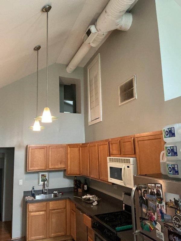 Conducted residential drain and sewer estimate for kitchen plumbing modification. Assessment revealed need to relocate drain line approximately one-quarter inch to accommodate cabinet or appliance installation requirements. Documented existing plumbing configuration and spatial constraints in kitchen area with vaulted ceilings and exposed ductwork to determine feasibility and scope of drain repositioning work.