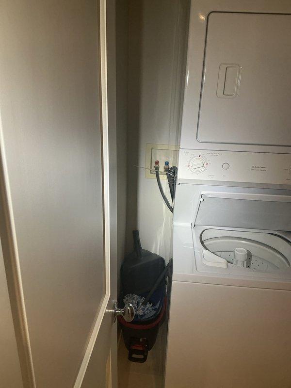 Responded to a callback for laundry appliance plumbing connections. Inspected washing machine water supply lines, shut-off valves with red handles, and flexible hose connections in recessed wall box. Verified proper installation and function of plumbing fixtures serving the top-loading washer unit. All connections were found to be secure and operating correctly.