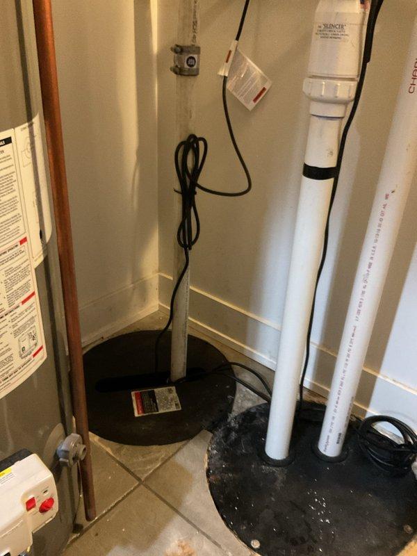 Inspected and evaluated existing sump pump system in basement utility area. Documented current equipment configuration including PVC discharge piping, basin assembly, and electrical connections. Assessed water management system performance and identified maintenance needs. Photographed equipment setup and surrounding plumbing infrastructure for service records. Provided recommendations for system optimization and preventive maintenance to ensure reliable operation and protect against basement water intrusion.