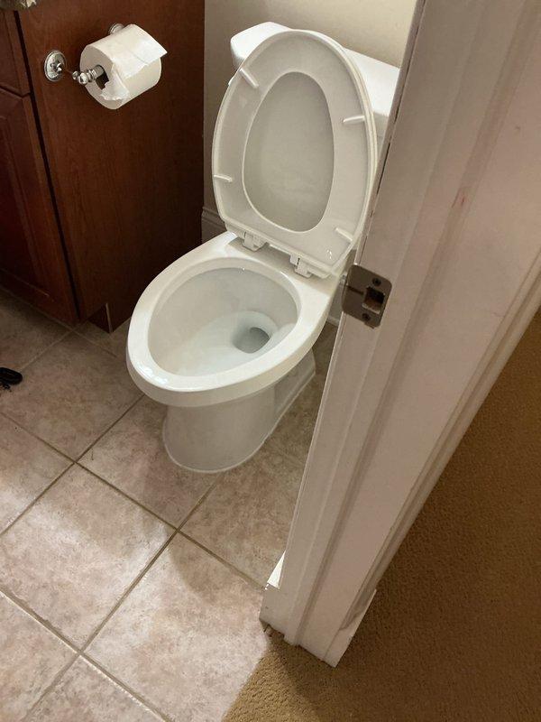 Completed toilet replacement in basement bathroom of 25-year-old residential property. Removed existing two-piece toilet fixture and installed new standard white porcelain toilet with tank and bowl assembly, ensuring proper sealing, secure mounting, and connection to existing water supply and drain lines. Verified proper flush operation and checked for leaks upon completion.