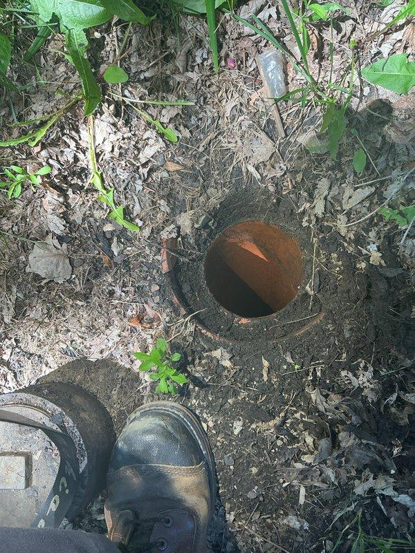 Responded to service call for broken external main sewer line cleanout. Conducted thorough inspection and documentation of the damaged cleanout assembly, revealing severe corrosion and deterioration of the cast iron pipe interior with extensive rust accumulation throughout the visible sections. Assessed the cleanout access point at ground level and documented the compromised condition of the pipe structure to determine scope of necessary repairs and potential requirement for interior drain system mapping to identify full extent of line damage.