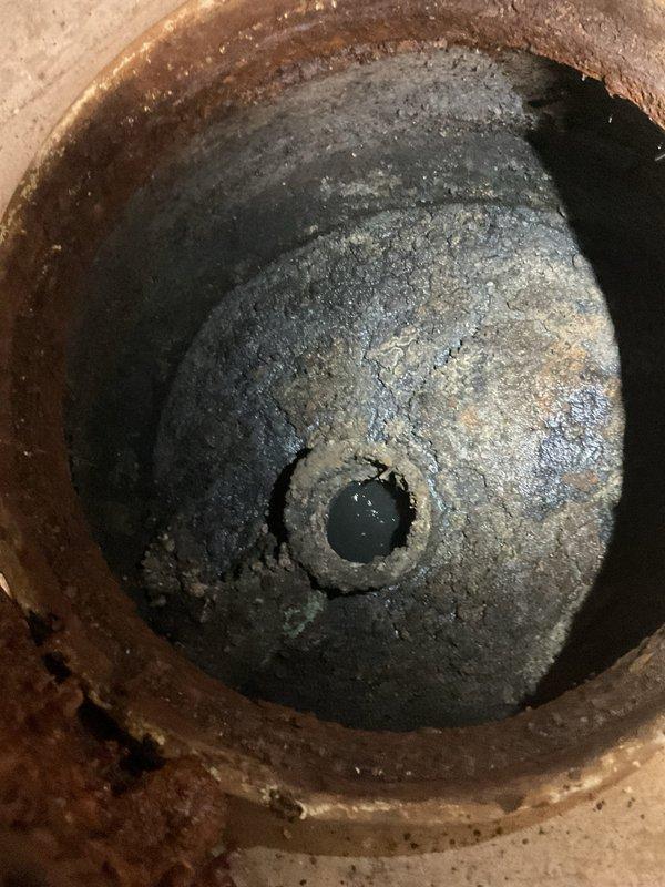 Performed annual kitchen stack line jetting service for commercial building after receiving complaints of kitchen sink backups in units 301 and 101 on the 01 stack. Inspected and documented the east (rear) kitchen stack joint, identifying dissimilar metal connection where a non-copper joint was installed in the copper stack system, causing galvanic corrosion and internal deterioration. Successfully cleared the kitchen drain line and provided detailed explanation of the corrosion issue to building management for future remediation planning.