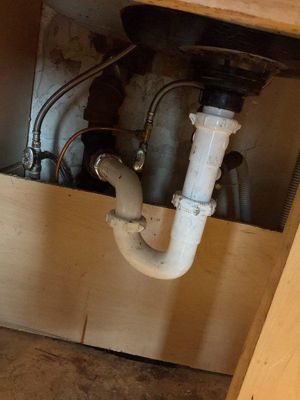 Responded to priority service call for slow-draining kitchen sink. Upon inspection, cleared blockage from drain line and tested water flow to confirm proper drainage. Verified P-trap assembly and connections were secure with no leaks present, ensuring full restoration of normal sink function.