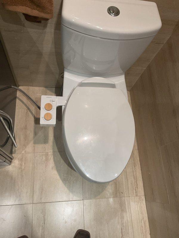 Successfully installed new bathroom vanity with integrated white countertop, single-handle chrome faucet, and pop-up drain assembly, including complete P-trap connection and cabinet mounting. Installed new dual-flush toilet with elongated bowl and soft-close seat, ensuring proper wax ring seal and water supply connection. All fixtures tested for proper operation and verified leak-free performance upon completion.