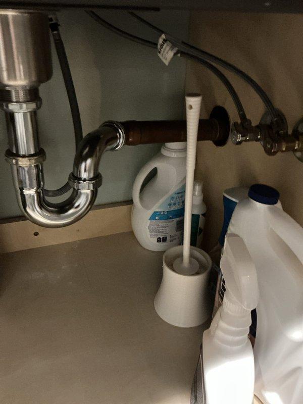 Responded to a service call for a washing machine backing up into the utility sink. Upon inspection, accessed the under-sink plumbing and identified drainage issues affecting the laundry system. Cleared the clog and restored proper drainage flow, eliminating the backup condition between the washing machine and utility sink.