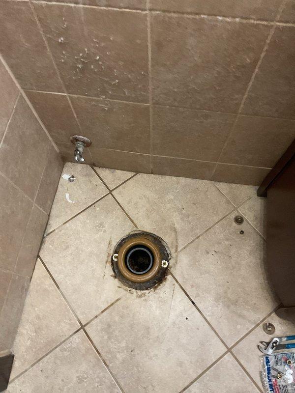 Responded to toilet leak causing water damage in basement. Upon inspection, determined toilet had shifted from original position, compromising wax ring seal at floor flange connection. Removed and reset toilet, installed new wax ring, and tightened closet bolts to proper torque specifications. Inspected tank components including fill valve, flush valve, and flapper assembly for proper operation. Verified all connections were secure and tested for leaks. Confirmed no further water seepage to basement level.